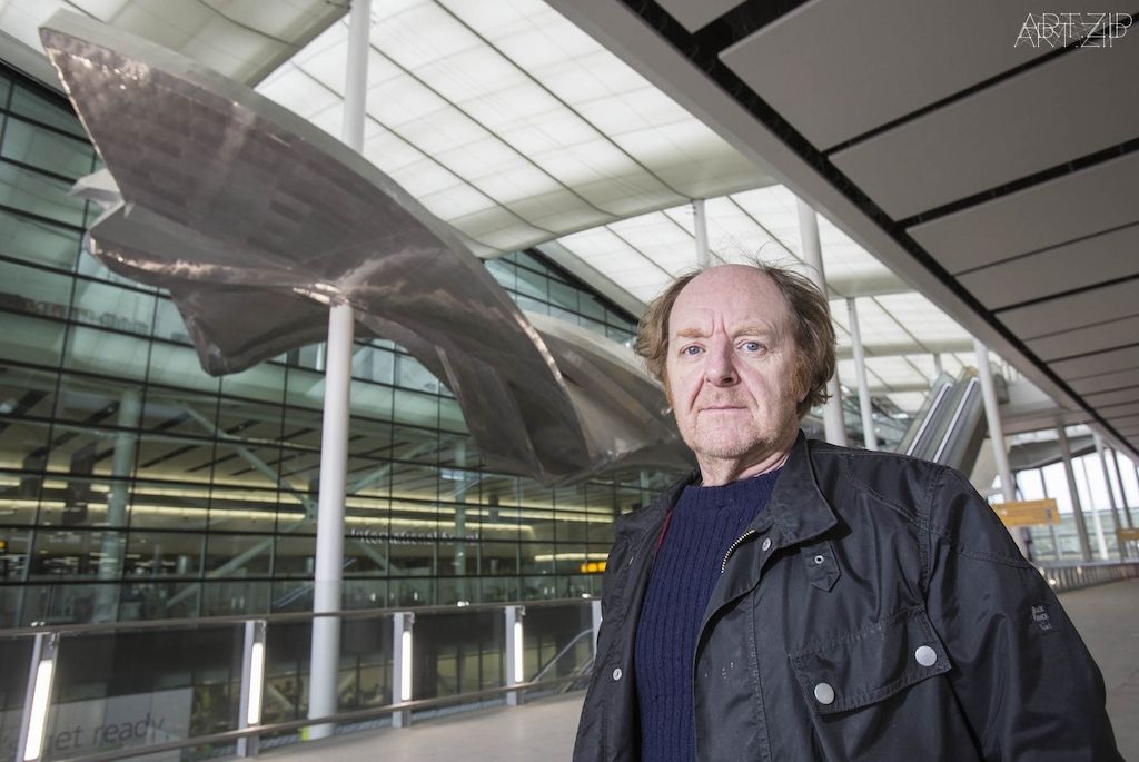 Richard Wilson with his sculpture Slipstream at Heathrow's new Terminal 2 The Queen's Terminal. Photograher Anthony Charlton